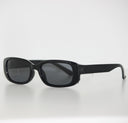 Black Robusto safety glasses with clear side shields, viewed from the side on a white surface